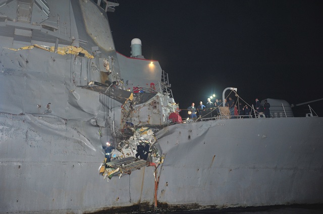 One of the U.S. Navy's guided-missile destroyers, USS Porter (DDG 78) suffered some damage after colliding with an oil tanker early Sunday in the strategic Strait of Hormuz. No personnel on either vessel were reported injured. 