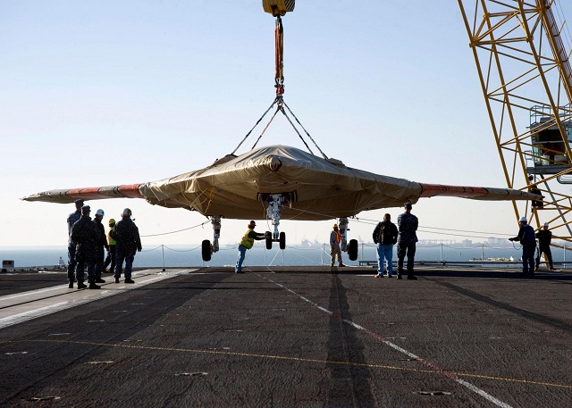 The U.S. Navy hoisted an X-47B Unmanned Combat Air System (UCAS) demonstrator on board aircraft carrier USS Harry S. Truman (CVN 75) Nov. 26, in preparation for an unmanned aircraft's first, carrier-based testing.