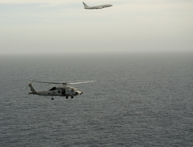 A P-8A Poseidon aircraft assigned to Patrol Squadron (VP) 8 conducts the first West Coast integrated Anti-Submarine Warfare (ASW) training exercise with an MH-60R helicopter from Helicopter Maritime Strike Squadron (HSM) 75 in the Southern California operating area on April 30, 2015. After the US, Australia will become the second nation to deploy the P-8A Poseidon with the MH-60R Romeo for Anti-Submarine Warfare and Anti-Surface Warfare missions.