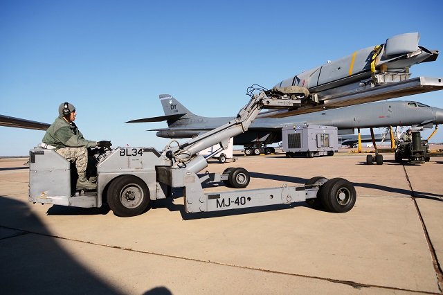 U.S. Air Force Tech. Sgt. Rene Ayala, 7th Maintenance Group load standardization crew member, maneuvers a Long Range Anti-Ship Missile (LRASM) in preparation for an upcoming test flight Feb. 2 at Dyess Air Force Base, Texas. The Navy, Air Force and Defense Advanced Research Projects Agency (DARPA) completed the test Feb. 4, successfully launching the LRASM from an Air Force B-1 Bomber. (U.S. Air Force photo)