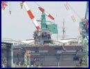 Recent pictures have emmerged showing the construction work in progress on Japan Maritime Self Defense Force (JMSDF) second Izumo-class helicopter carrier. The island has been placed on the hull of the destroyer in the dry construction dock at the Ishikawajima-Harima Heavy Industries Co., Ltd (IHI Corporation) in Yokohama. The DDH-184 which has yet to be nammed should be launched in August this year.