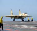 The picture taken on June 19 shows that the officers and men of the aviation department of the “Liaoning Ship” are guiding a ship-borne J-15 fighter to the take-off position. (Chinamil.com.cn/Li Tang)
