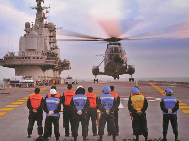 A Chinese Navy Z-8 Helicopter about to touch down on Liaoning aircraft carrier (ex-Varyag)