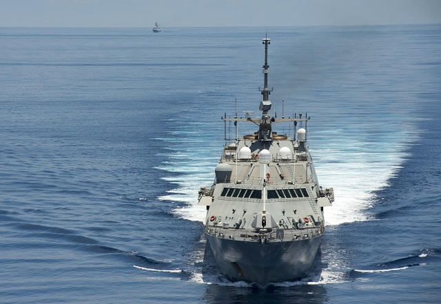  SOUTH CHINA SEA (May 11, 2015) The littoral combat ship USS Fort Worth (LCS 3) conducts patrols in international waters of the South China Sea near the Spratly Islands as the People's Liberation Army-Navy [PLA(N)] guided-missile frigate Yancheng (FFG 546) transits close behind. (U.S. Navy photo by Mass Communication Specialist 2nd Class Conor Minto/Released)