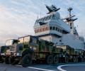 Dixmude LHD's deck is used to carry additional support vehicles.